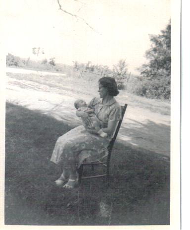 Mother holding me in 1952